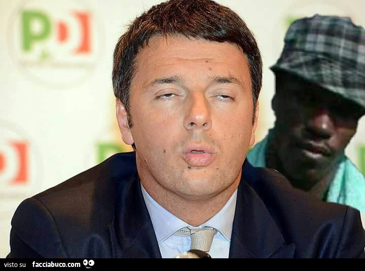 Renzi intontito con dietro il negro di whatsapp